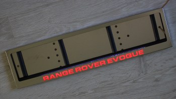 Авторамка Range Rover Evoque из нержавейки с подсветкой надписи